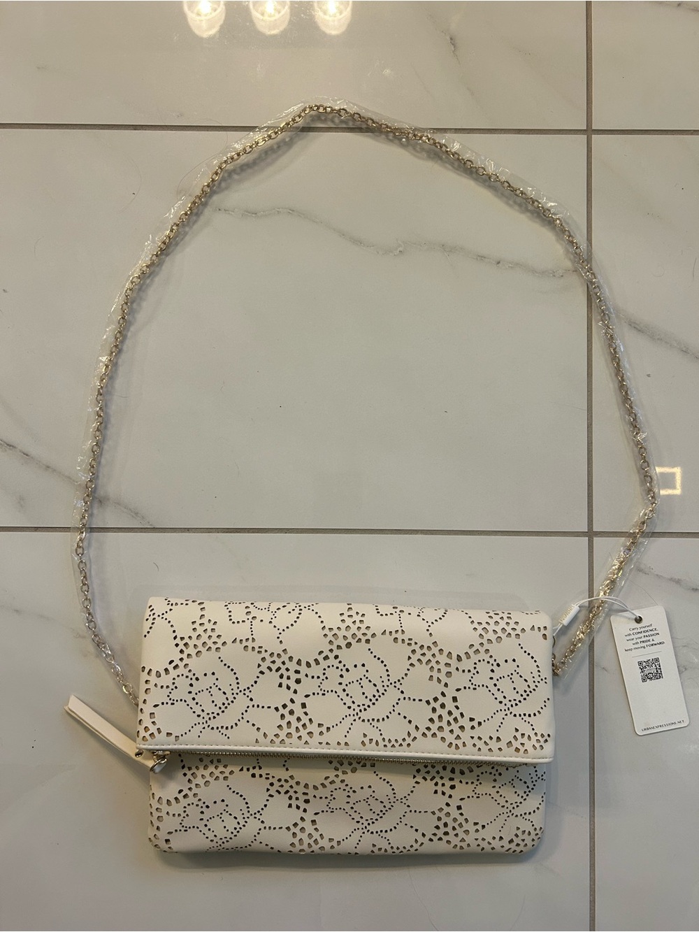 NWT Urban Expressions White Floral Laser Cut
Foldover Crossbody Clutch Vegan